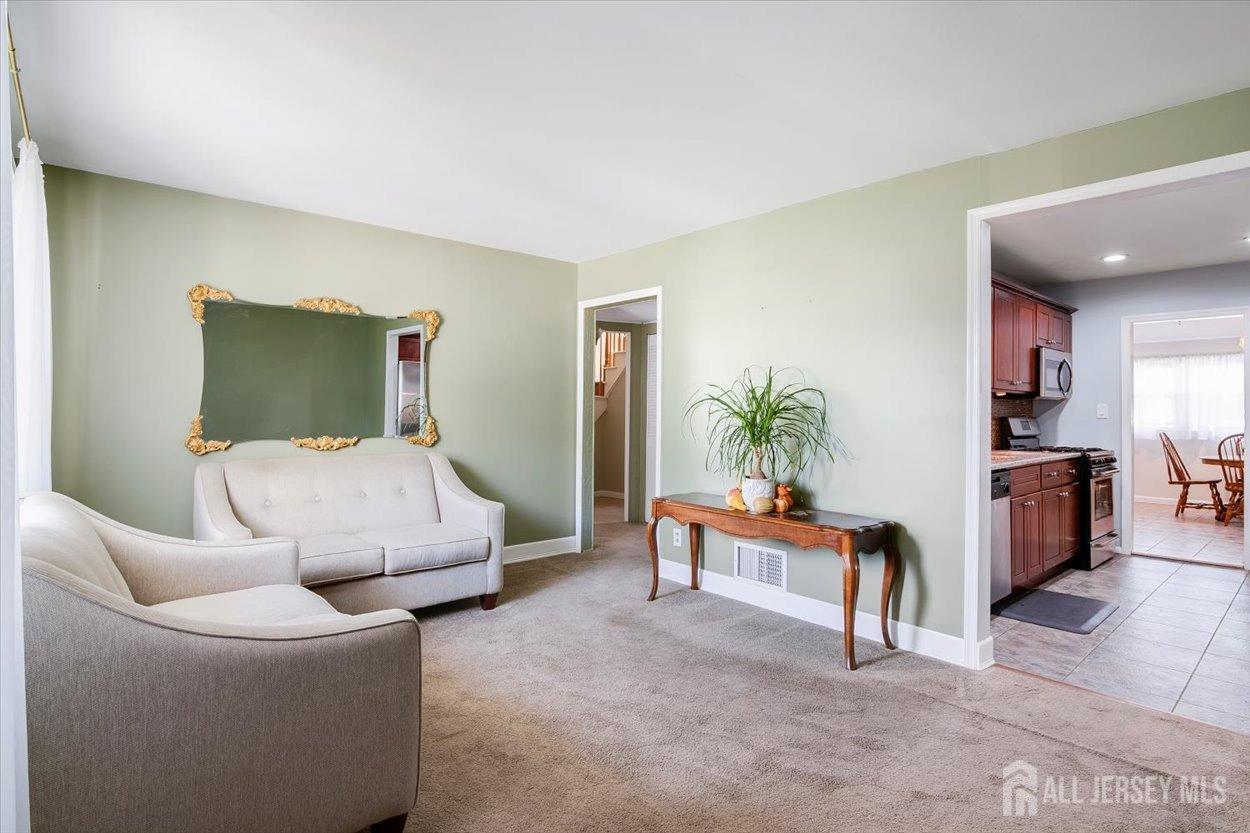 63 Glenville Road Edison, NJ 08817 - Photo 3 of 38 a bedroom with furniture and a couch