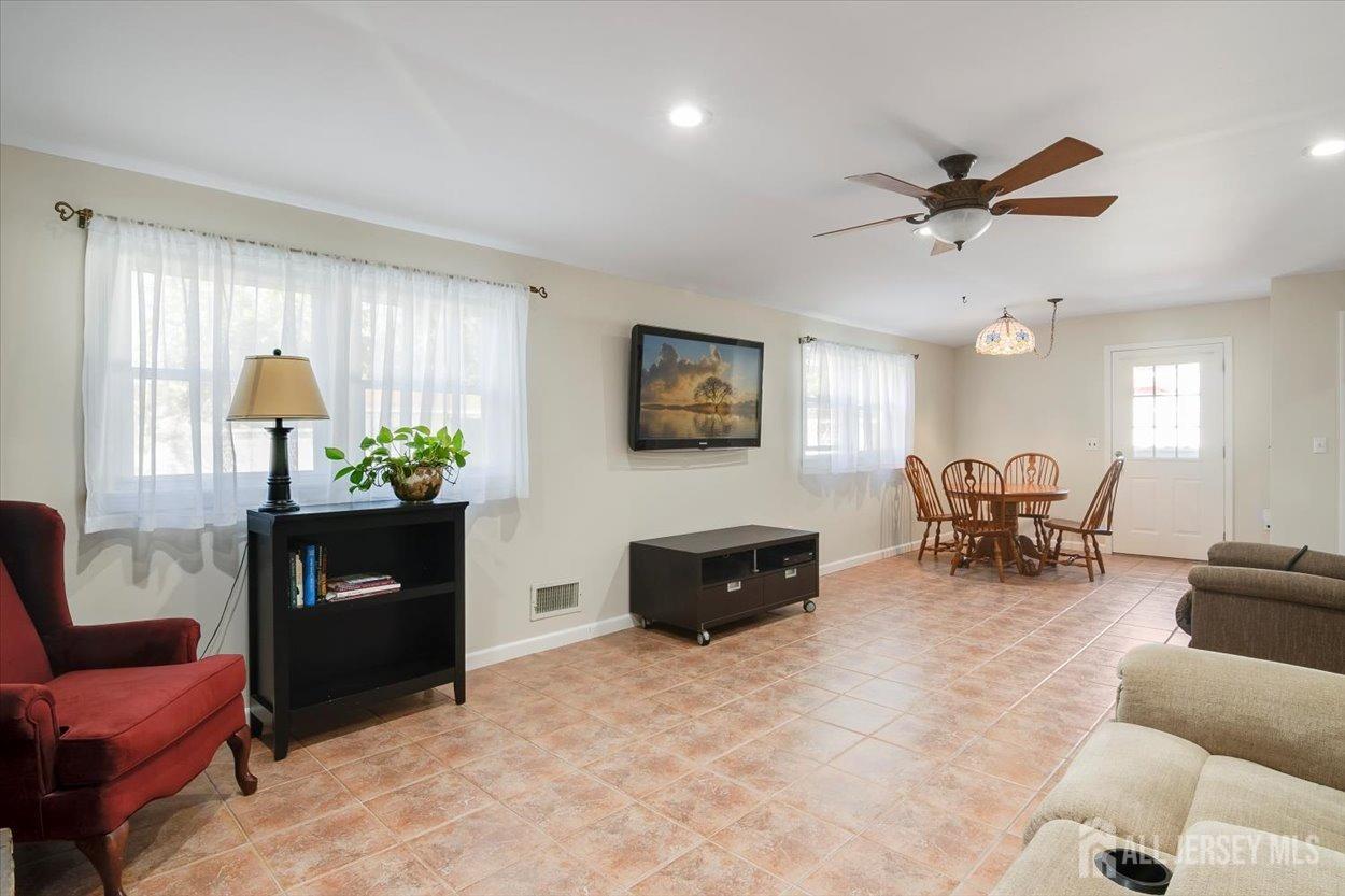 63 Glenville Road Edison, NJ 08817 - Photo 9 of 38 a living room with furniture and wooden floor