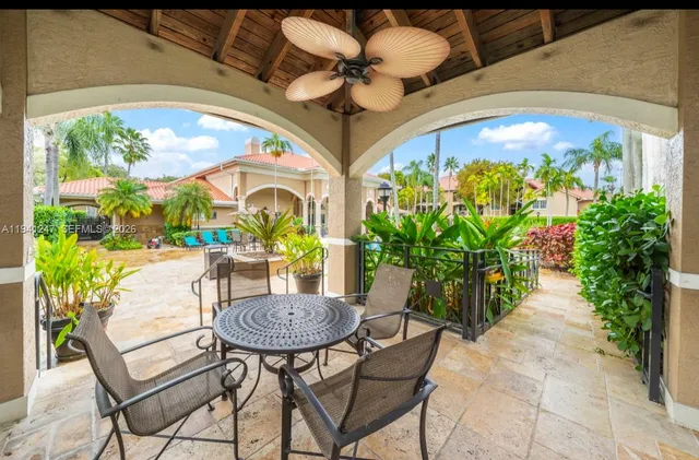 a view of a chairs and table in a patio