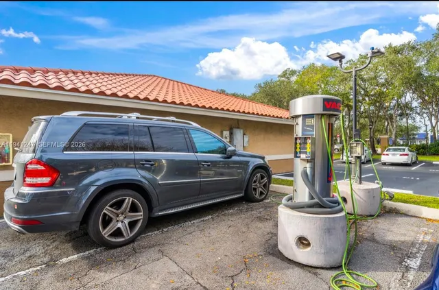 a front view of a house with parking space