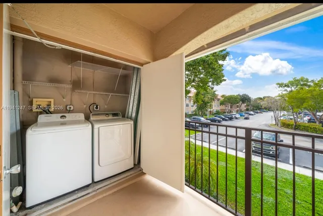 a view of a room with washer and dryer