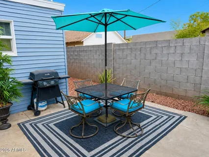 swimming pool view with a seating space