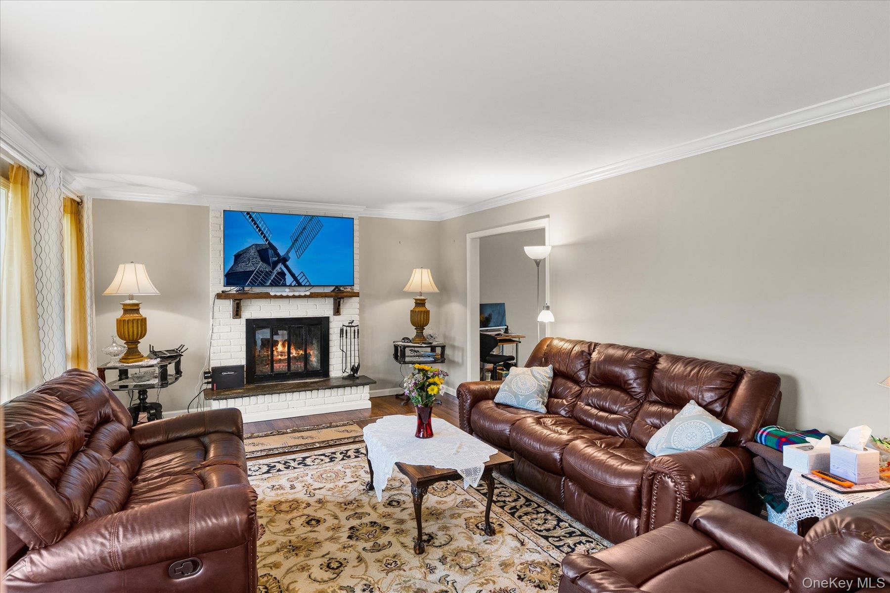 6 George Court Miller Place, NY 11764 - Photo 2 of 33 a living room with furniture and a fireplace