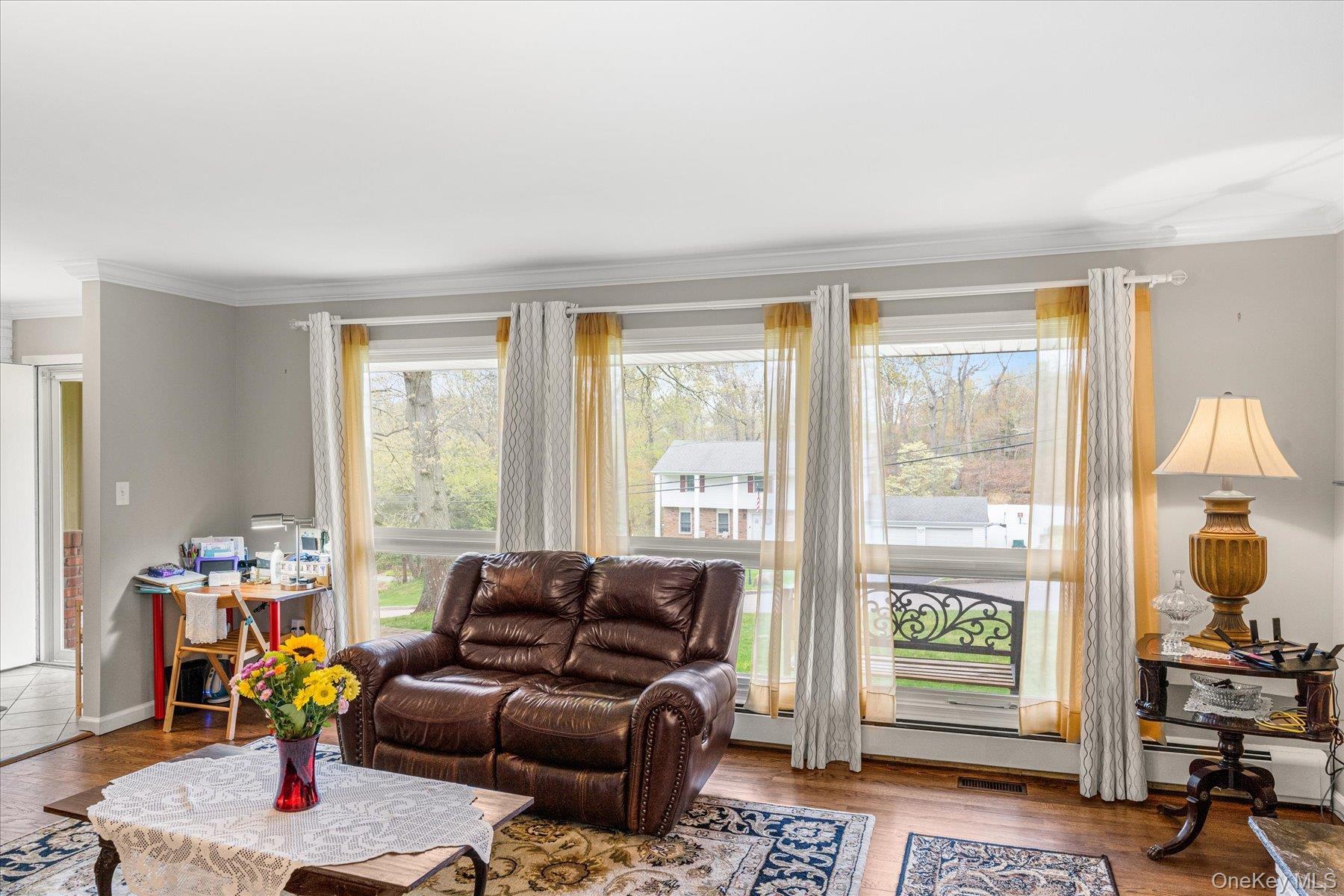 6 George Court Miller Place, NY 11764 - Photo 3 of 33 a living room with furniture and a window