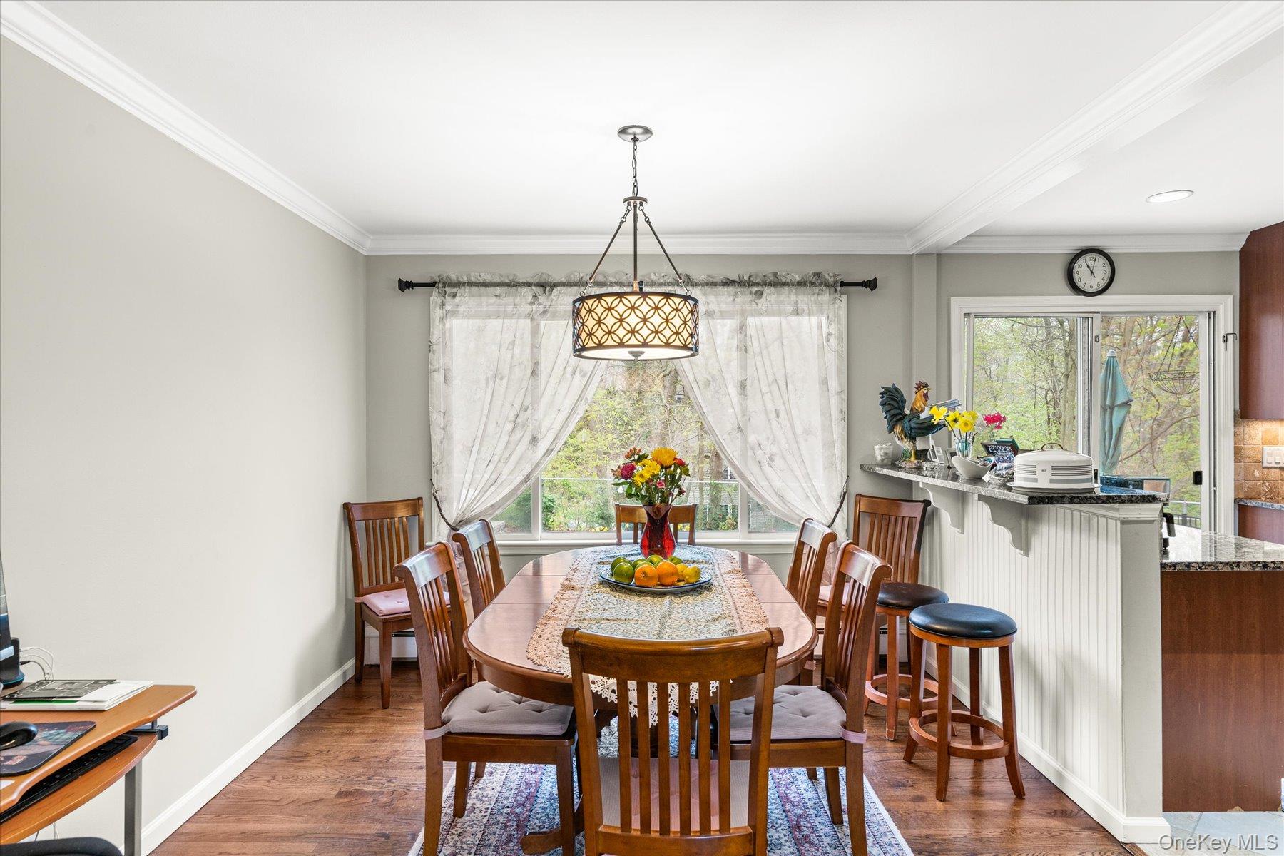 6 George Court Miller Place, NY 11764 - Photo 4 of 33 a view of a dining room with furniture window and wooden floor