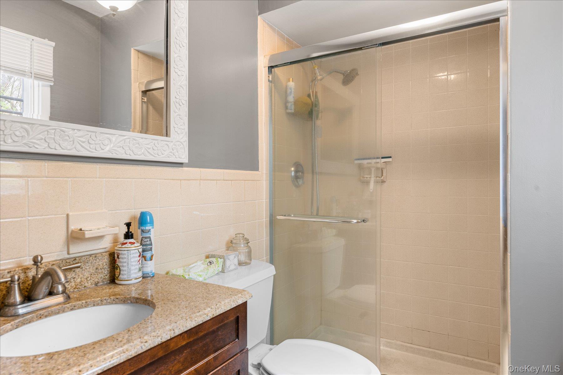 6 George Court Miller Place, NY 11764 - Photo 10 of 33 a bathroom with a granite countertop sink toilet and shower