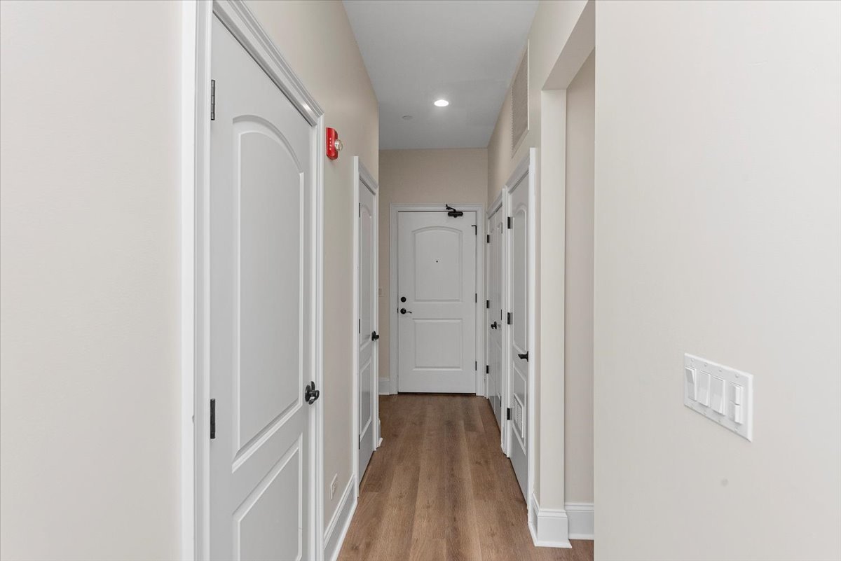 2500 Green Bay Road, Unit 403 Evanston, IL 60201 - Photo 14 of 16 a view of a hallway with wooden floor and staircase