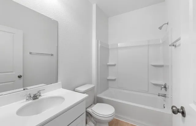 a view of an empty room with windows