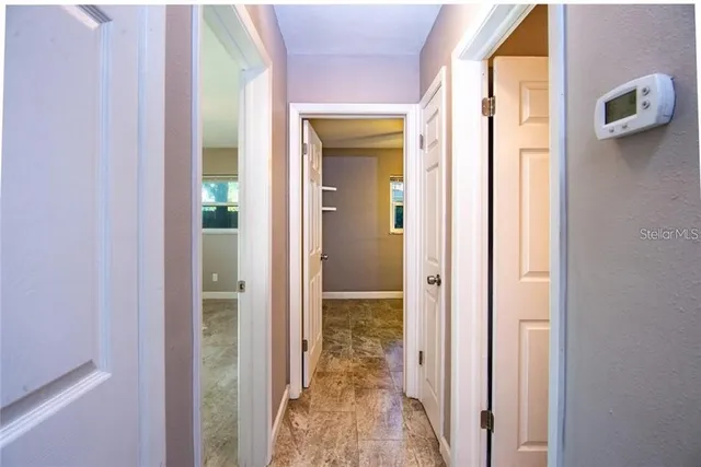 a view of a bathroom from a hallway