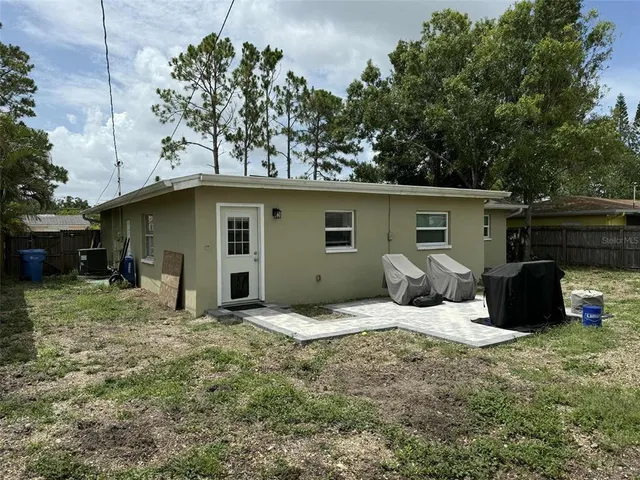 a house with trees in the background