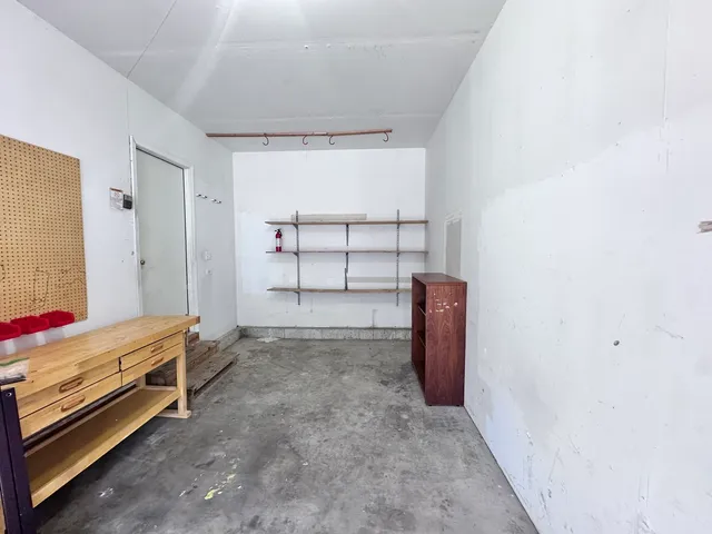 a view of room with walk in closet and window