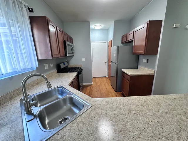 a bathroom with a sink double vanity and a mirror