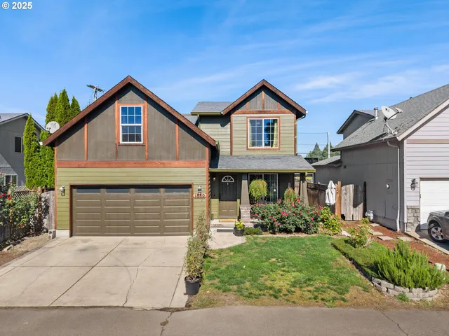 a front view of a house with garden
