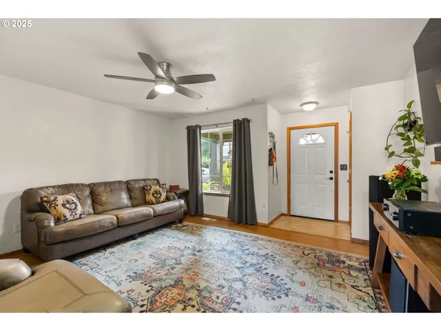 a living room with furniture and flowers