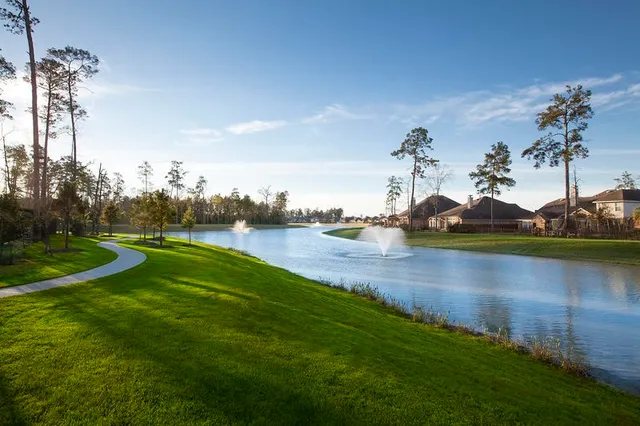 a view of a lake with houses in the back