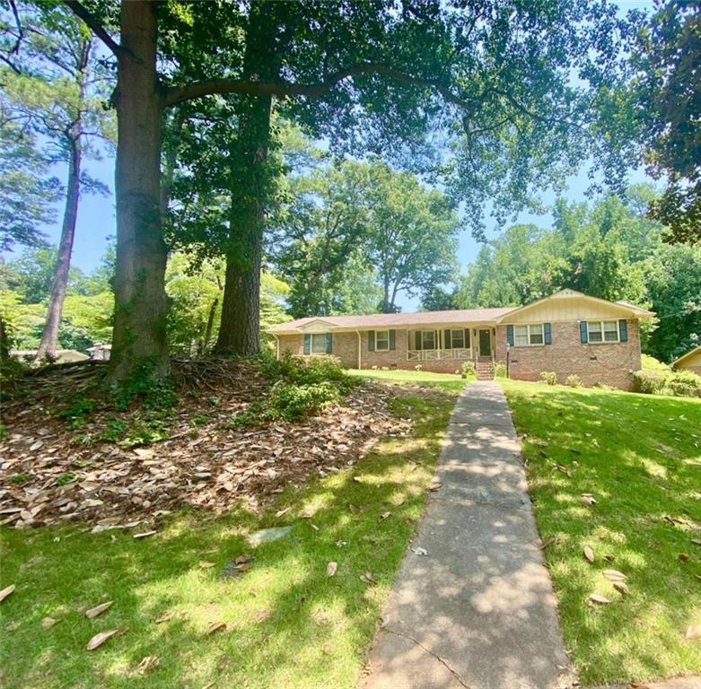 3146 East Chapel Circle Decatur, GA 30034 - Photo 1 of 1 a front view of a house with garden