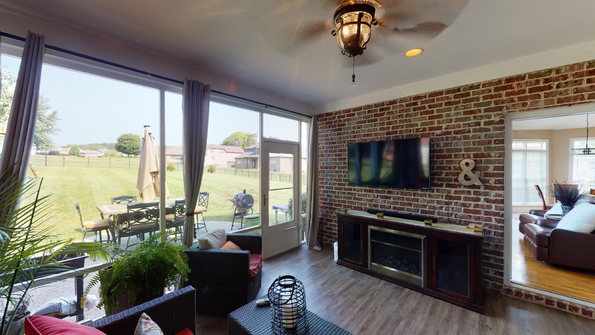 420 Ridgecrest Lane Lebanon, TN 37087 - Photo 17 of 29 a living room with furniture a flat screen tv and a fireplace