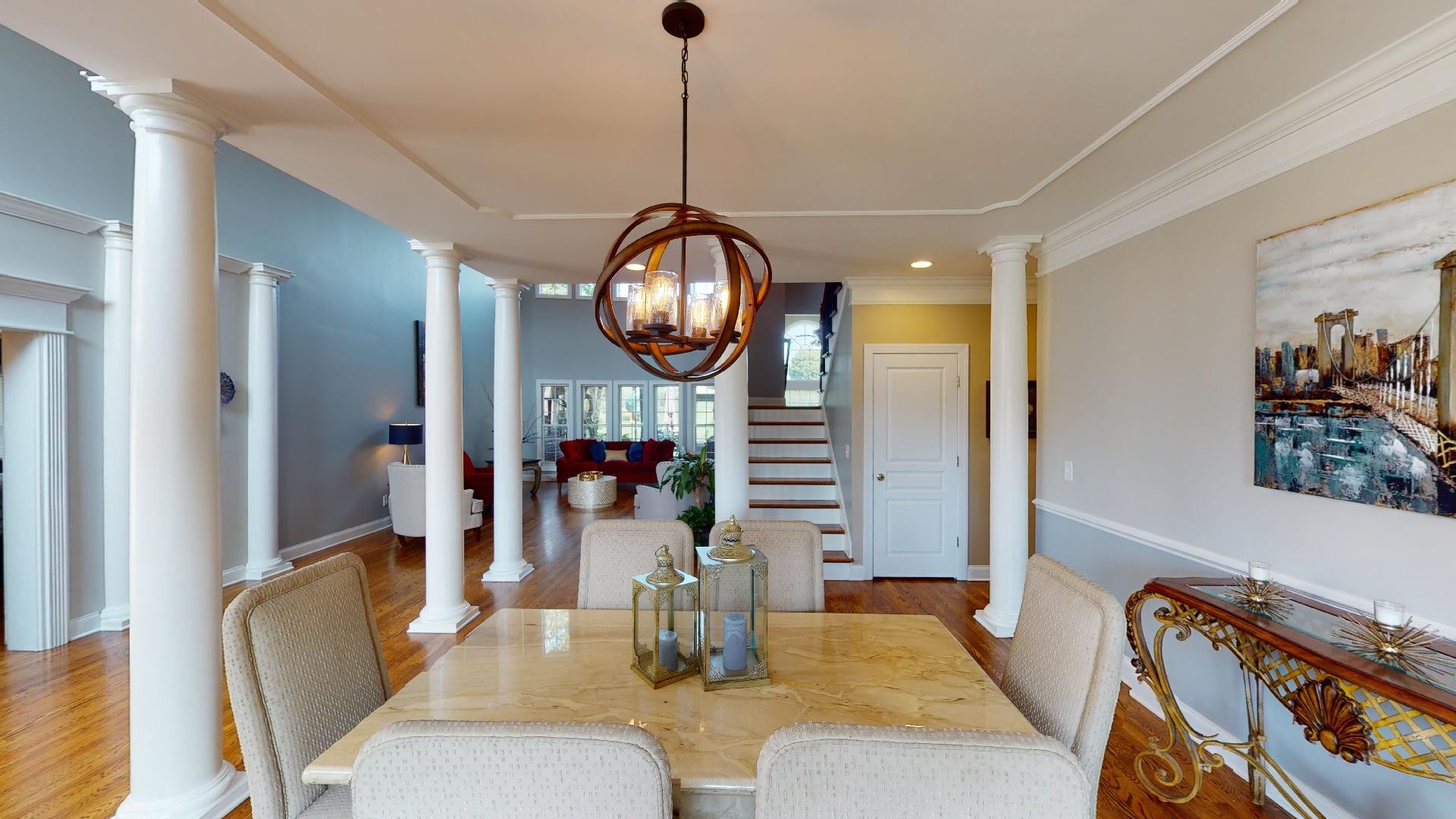 420 Ridgecrest Lane Lebanon, TN 37087 - Photo 4 of 29 a living room with couches a mirror and dining table with wooden floor