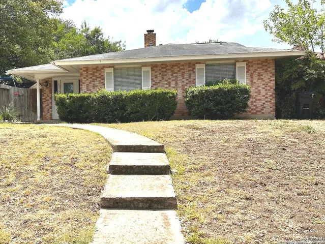 a view of house with yard