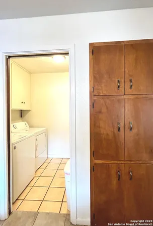 a bathroom with a shower and a sink
