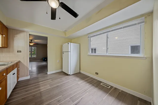 a view of a livingroom with wooden floor