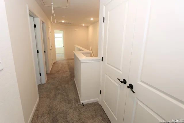 a view of a hallway with closet