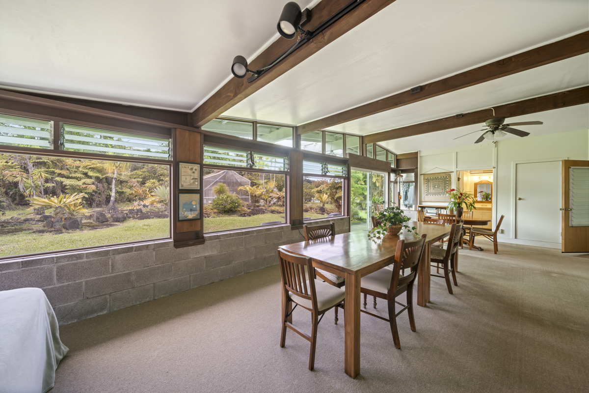 1808 Waianuenue Avenue Hilo, HI 96720 - Photo 14 of 30 a dining room with furniture and a floor to ceiling window