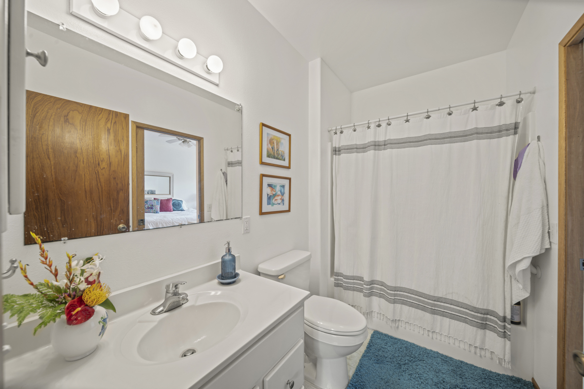 1808 Waianuenue Avenue Hilo, HI 96720 - Photo 21 of 30 a bathroom with a sink toilet and shower