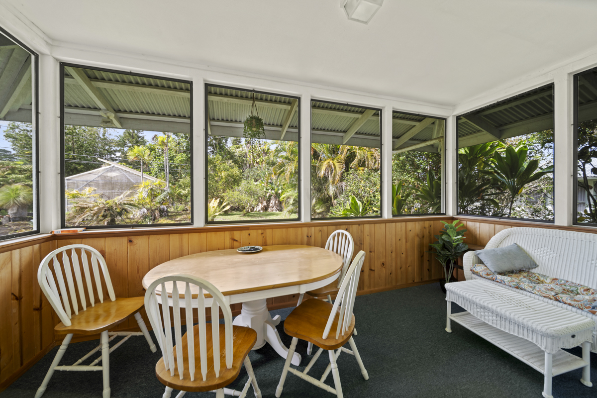 1808 Waianuenue Avenue Hilo, HI 96720 - Photo 25 of 30 a view of a dining room with furniture wooden floor and a window