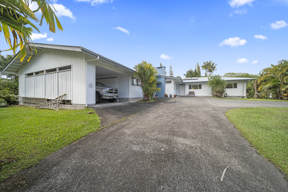 1808 Waianuenue Avenue Hilo, HI 96720 - Photo 29 of 30 a view of a house with a yard and sitting area