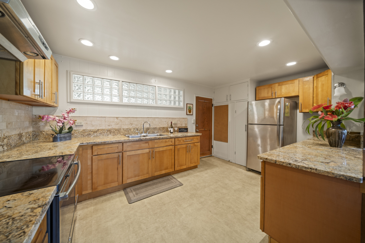 1808 Waianuenue Avenue Hilo, HI 96720 - Photo 4 of 30 a kitchen with refrigerator cabinets and a sink