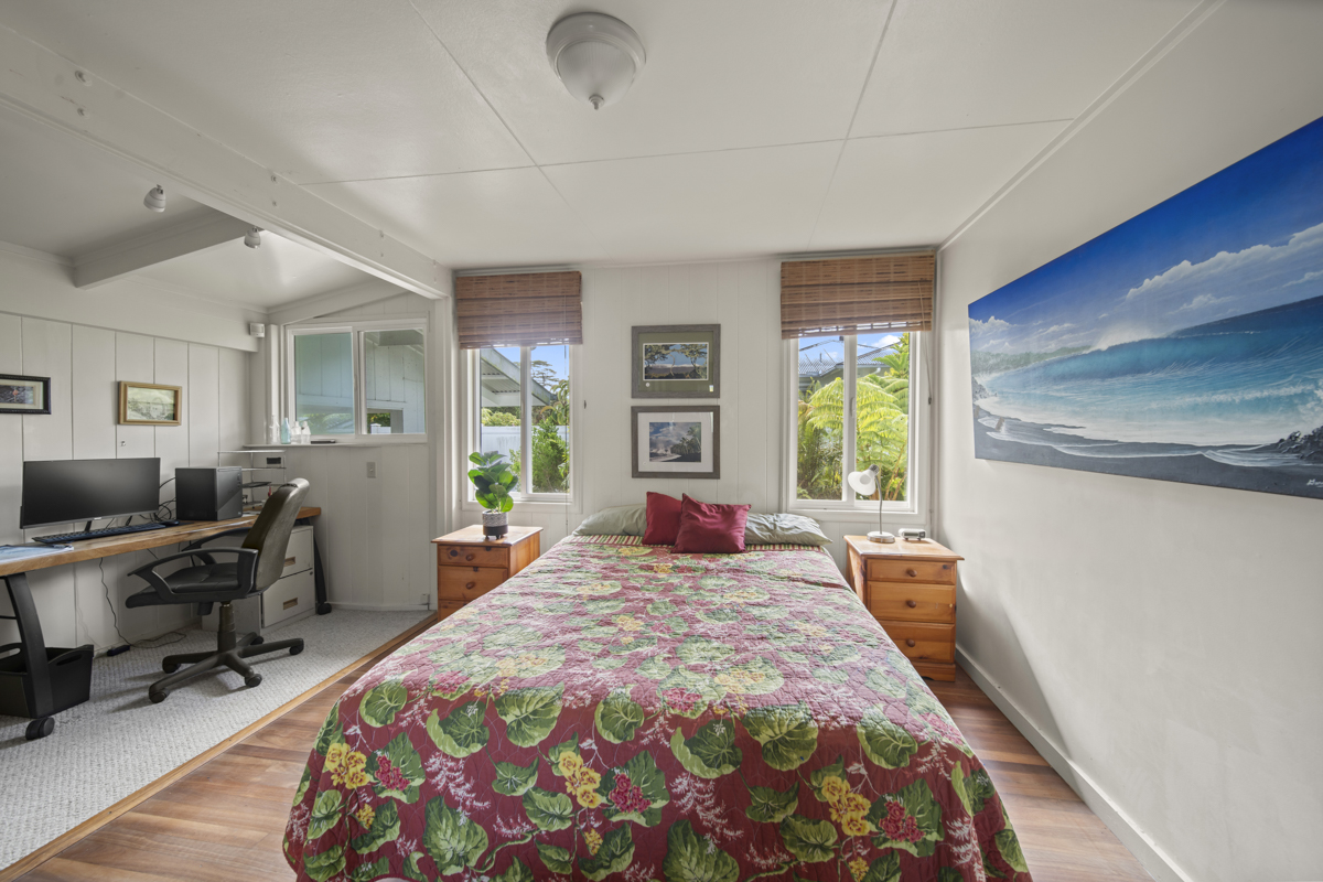 1808 Waianuenue Avenue Hilo, HI 96720 - Photo 10 of 30 a large bedroom with a bed and wooden floor