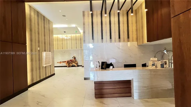 a kitchen with stainless steel appliances a stove and cabinets