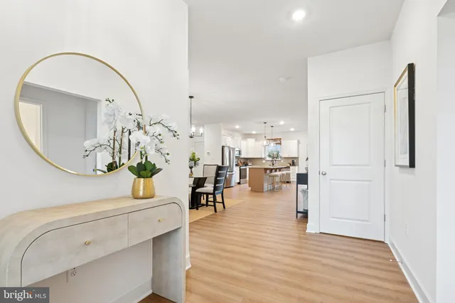 a view of an entryway with wooden floor