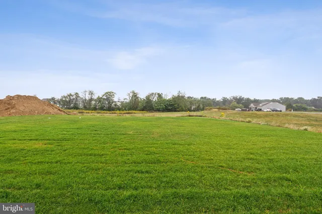 a view of a house with a big yard