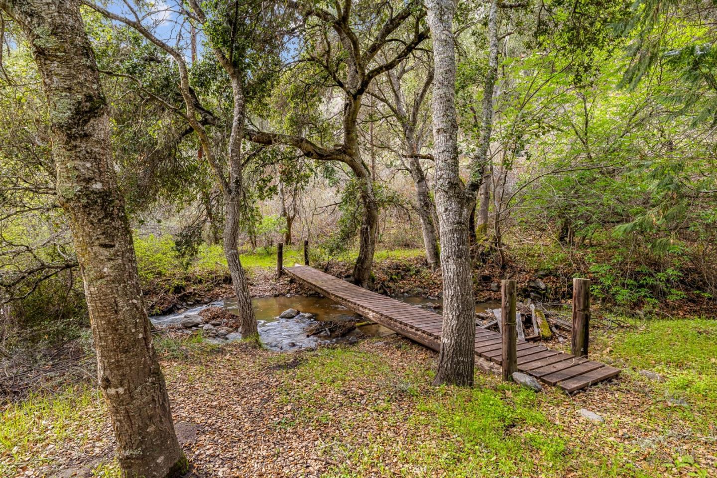 28750 Underwood Road Salinas, CA 93908 - Photo 32 of 71 a view of a backyard with wooden fence and a large tree