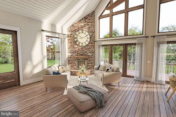 a living room with furniture and large windows