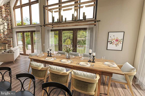 a view of a dining room with furniture a chandelier and wooden floor