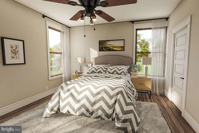 a bedroom with a bed and a window