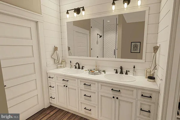 a bathroom with a double vanity sink and mirror