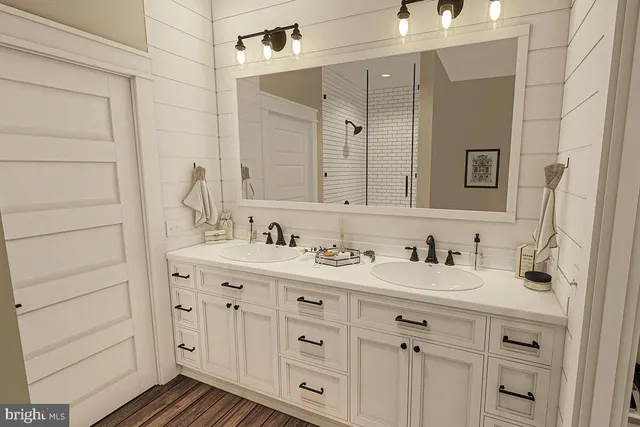 a bathroom with a double vanity sink and mirror