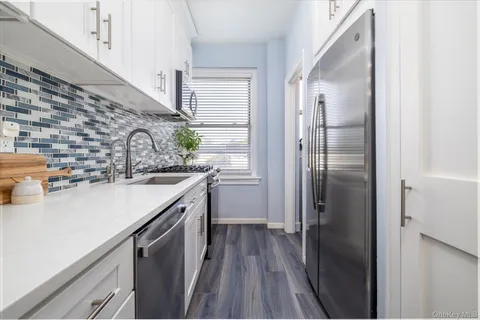 a kitchen with a sink and refrigerator