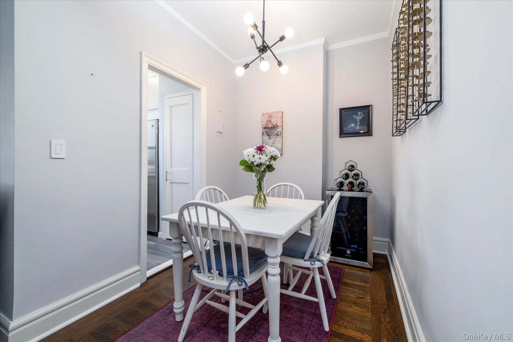 8 Barstow Road, Unit 4J Great Neck, NY 11021 - Photo 4 of 17 a view of a dining room with furniture and wooden floor