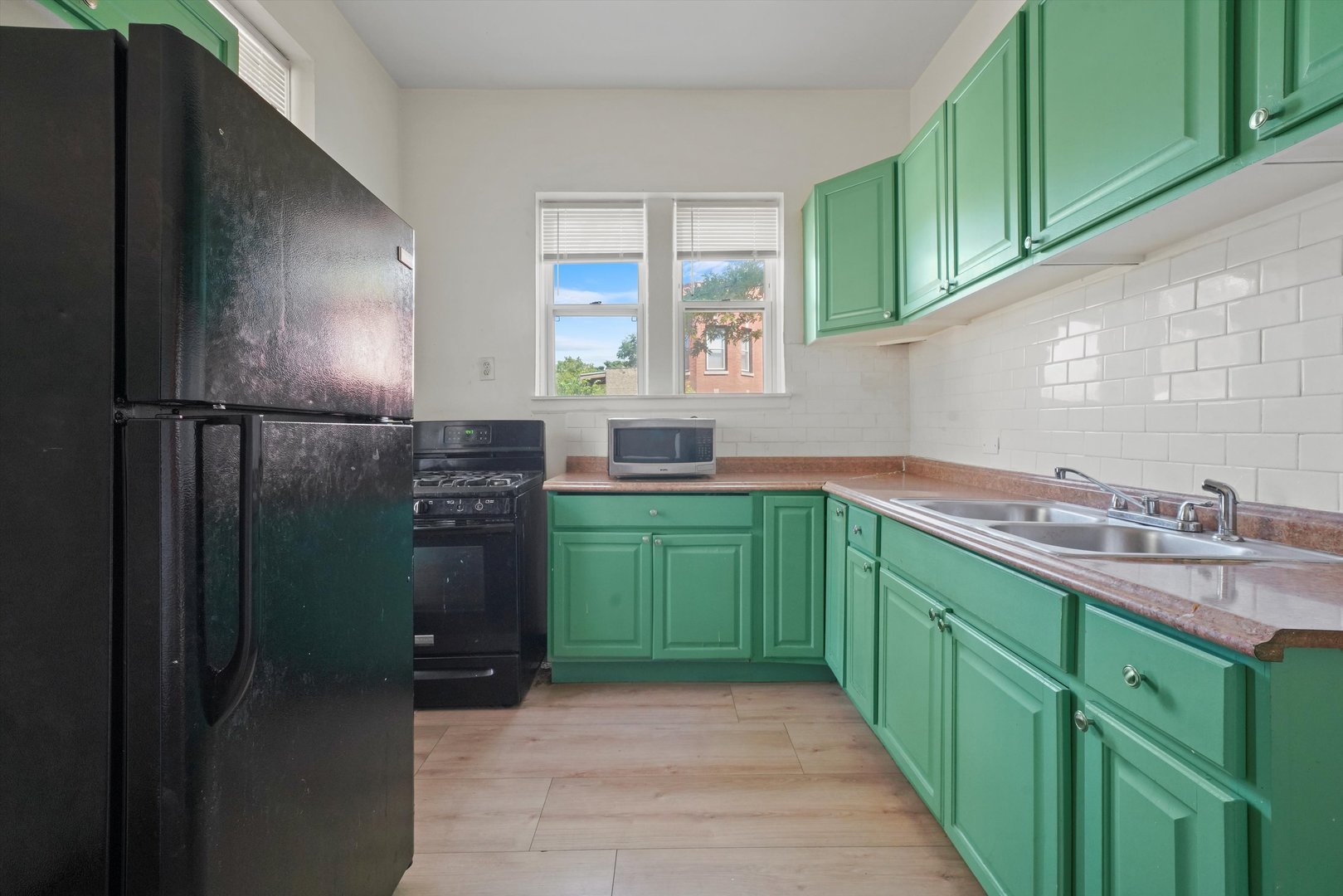 6600 South Marquette Road Chicago, IL 60637 - Photo 19 of 42 a kitchen with lots of counter space and a window