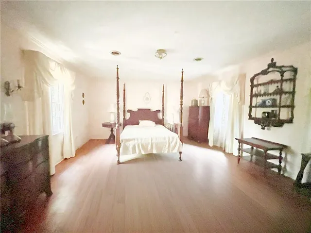 a bathroom with a sink mirror and window