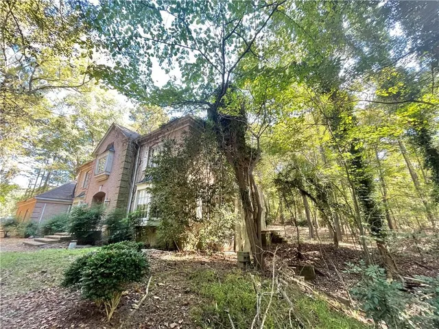 a backyard of a house with lots of green space