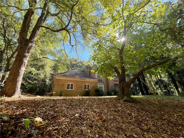 a view of a house with a tree