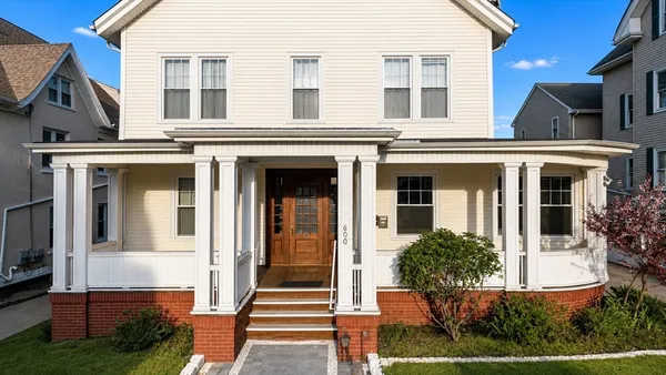 front view of a house with a yard