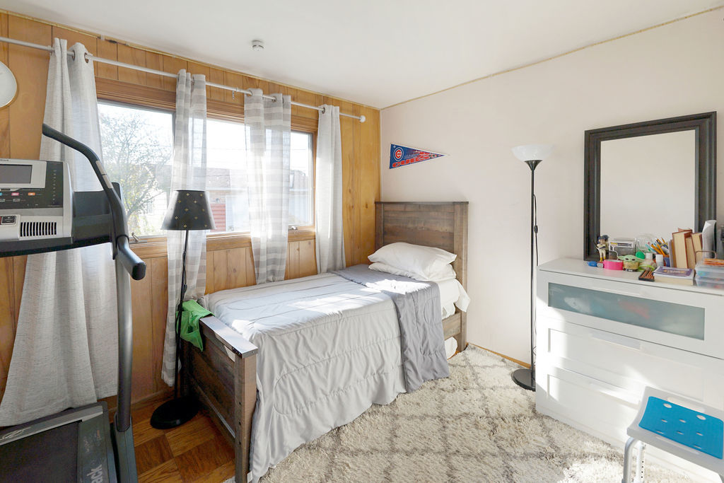 2503 Fulle Street Rolling Meadows, IL 60008 - Photo 11 of 17 a bedroom with a bed and a mirror