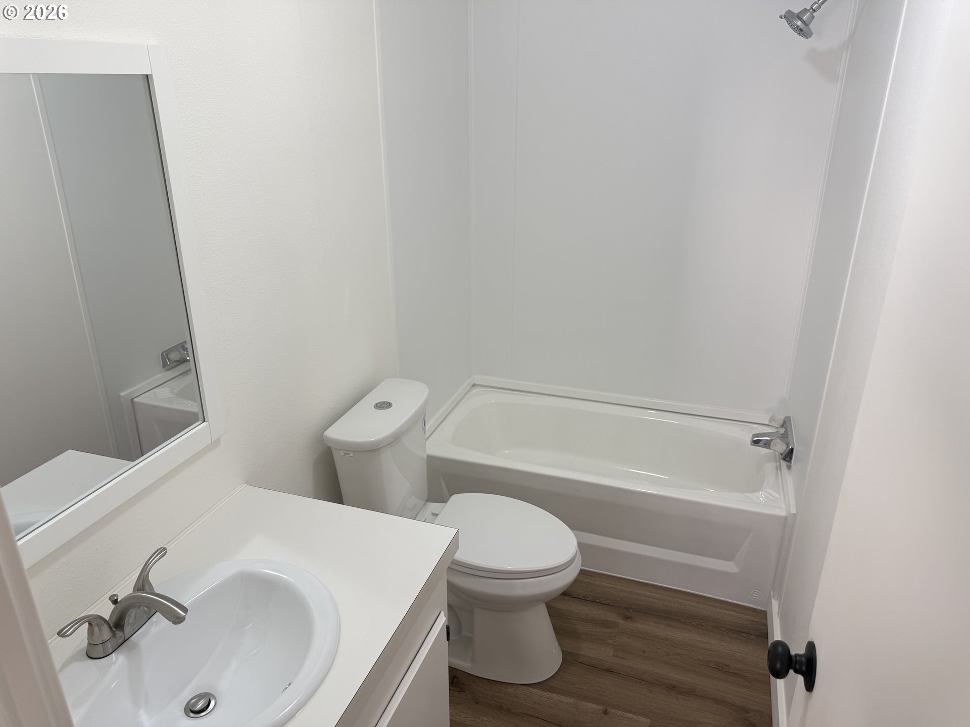 20140 Northeast Sandy Boulevard, Unit 103 Fairview, OR 97024 - Photo 12 of 15 a white toilet sitting next to a bathroom sink